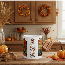 Load image into Gallery viewer, White mug with 'Fall Harvest' design in a kitchen setting with autumn decorations.