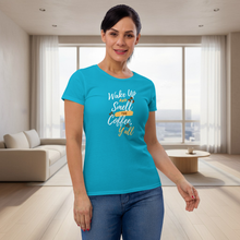 Load image into Gallery viewer, Woman wearing a blue t-shirt with text in a modern living room