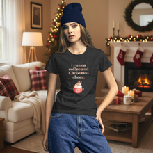 Load image into Gallery viewer, Woman wearing a heather dark grey t-shirt with festive text in a cozy living room decorated for Christmas.