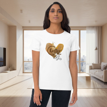 Load image into Gallery viewer, Woman wearing a white t-shirt with a gold heart design in a modern living room.