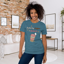 Load image into Gallery viewer, Woman wearing a blue t-shirt with a coffee cup graphic and text in a living room.