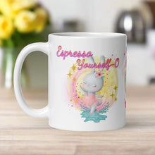 Load image into Gallery viewer, Left side view white glossy mug with image phrase "Espresso Yourself-o," featuring a watercolor bunny ballerina dancing in a small puddle of water surrounded by pastel yellow and pink glitter and pink swirls.