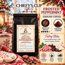 Load image into Gallery viewer, A bag of Chiefy's Cup Coffee Co. Frosted Peppermint Ground Coffee is shown in a festive holiday setting with Christmas trees, peppermint candies, and hot cocoa cups.