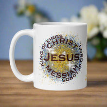 Load image into Gallery viewer, Left side view of the white glossy mug featuring the phrase "King of Kings, Lord of Lords, Messiah, Christ, Jesus," with golden and blue sparkles in the background.