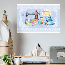 Load image into Gallery viewer, Front view 24″×36″ wall art  with image image phrase stitch sip repeat, with image design vintage sewing machine, with floral bouquet, with sewing accessories, with vintage kettle with cup and saucer, with lace border, with light blue background