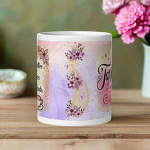 Load image into Gallery viewer, Back side view of a white glossy mug with a design featuring watercolor pink and purple flowers, purple butterflies, and a golden stream of glitter.