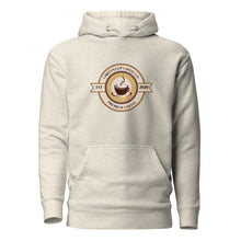 Load image into Gallery viewer, A light beige pullover hoodie with a circular coffee-themed graphic on the chest. The graphic features a coffee cup illustration and the text 'Chiefy's Cup Coffee Co' and 'Premium Coffee' along with 'EST 2020.