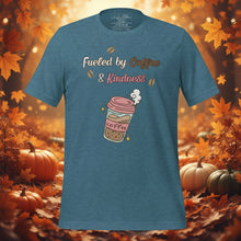 Load image into Gallery viewer, unisex heather deep teal t-shirt with image phrase fueled by coffee and kindness, with image graphic of a pink cup with coffee and steam, coffee beans, gold sparkles