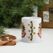 Load image into Gallery viewer, Back side view of a white glossy mug with a design of a festive garland with red bows, Christmas ornaments, gingerbread cookies, and golden sparkles in the background.