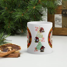 Load image into Gallery viewer, Back side view of a white glossy mug with Christmas gnomes in red plaid, golden and green swirly trees in the background, golden speckles, and red snowflakes.