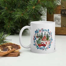 Load image into Gallery viewer, Left side view of a white glossy mug with an image design featuring a red farmhouse, a red plaid truck carrying a Christmas tree, a man and woman holding presents in the front yard, reindeer in the background, and a forest encased in a blue and red-hued wreath.