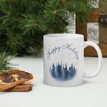 Load image into Gallery viewer, Right side view of a white glossy mug with the image phrase "Happy Holidays" in festive font, featuring vintage-looking pine trees on a wintery day, with golden sparkles.