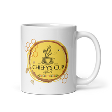Load image into Gallery viewer, A white ceramic coffee mug featuring a circular yellow and brown graphic design with the text 'CHIEFY'S CUP Coffee Co' and a coffee cup illustration, shown on a clean white background.