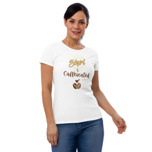 Load image into Gallery viewer, Woman modeling womens fitted white t-shirt with image phrase blessed and caffeinated, with image graphic of words in coffee oriented hues, coffee beans, brown small hearts