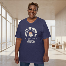 Load image into Gallery viewer, woman modeling unisex heather midnight navy t-shirt with image phrase chiefys cup coffee club, with phrase may your day be blessed and your coffee be strong, with image graphic of a cup with coffee , heart shaped froth in cup
