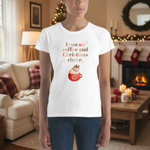 Load image into Gallery viewer, Person wearing a white t-shirt with a Christmas-themed design in a festive living room.
