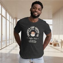 Load image into Gallery viewer, man modeling unisex dark grey t-shirt with image phrase chiefys cup coffee club, with phrase may your day be blessed and your coffee be strong, with image graphic of a cup with coffee , heart shaped froth in cup
