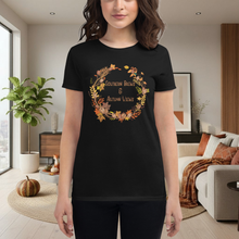 Load image into Gallery viewer, Person wearing a black t-shirt with autumn-themed design in a living room.
