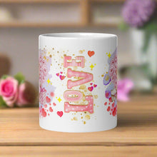 Load image into Gallery viewer, Back view of a white glossy mug featuring the word &quot;Love&quot; in a watercolor design, surrounded by red hearts and golden sparkles.
