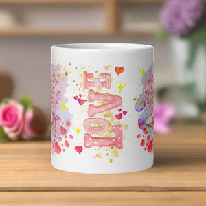 Back view of a white glossy mug featuring the word "Love" in a watercolor design, surrounded by red hearts and golden sparkles.