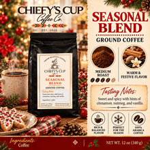 Load image into Gallery viewer, A bag of Chiefy's Cup Coffee Co. Seasonal Blend ground coffee is shown on a festive holiday-themed background with a mug of coffee, cookies, and decorative text describing the medium roast, warm and festive flavor, and tasting notes.
