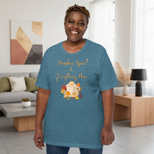 Load image into Gallery viewer, Person wearing a blue t-shirt with &#39;Pumpkin Spice &amp; Everything Nice&#39; design in a living room.
