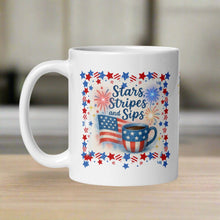 Load image into Gallery viewer, Right side view of white glossy mug featuring an American flag waving beside a cup of coffee decorated with a small American flag. Firecrackers are going off in the background, all framed with a red, white, and blue border.
