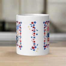 Load image into Gallery viewer, Back side view of white glossy mug with red, white and blue stars with golden sprinkles. 
