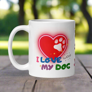 Left side view of a white glossy mug with a neon red heart featuring a white paw print inside, the phrase “I love my dog,” and the playful word “woof.”