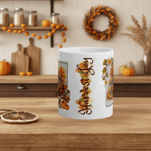 Load image into Gallery viewer, White mug with &#39;Happy Halloween&#39; design on a wooden table with autumn decorations in the background.
