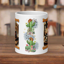 Load image into Gallery viewer, Back side view 20oz white glossy mug with an image design a rustic cowboy hat resting on a cactus, with small flowering cactus and small rocks at base, with small bird tracks, with small desert animals,  with cow skull, with wagon wheel, with sparkles and mist in background
