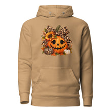 Load image into Gallery viewer, A khaki pullover hoodie with a front kangaroo pocket and a graphic print of a jack-o'-lantern decorated with leopard-print bows, sunflowers, and autumn leaves.
