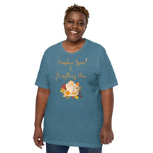 Load image into Gallery viewer, woman modeling wearing unisex heather deep teal t-shirt with image phrase Pumpkin spice and everything nice, with image graphic of a cup with pumpkin spice coffee and cream, fall leaves, mini pumpkin
