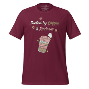 unisex maroon t-shirt with image phrase fueled by coffee and kindness, with image graphic of a pink cup with coffee and steam, coffee beans, gold sparkles