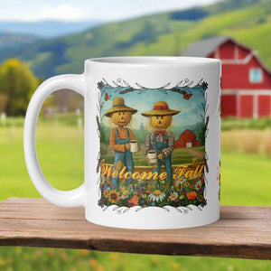 Left side view of a white glossy mug with the phrase "Welcome Fall" in festive font, featuring scarecrows in a field enjoying coffee, surrounded by wildflowers, with a red barn in the background.