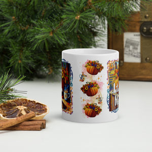 Back side view of white glossy mug with a vibrant fall colored  image design of a pumpkins with a vibrant arrangement of flowers on top of the pumpkin, with cups full of hot drink and cinnamon sticks, with pink hue in the background, with golden sprinkles