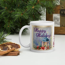 Load image into Gallery viewer, Left side view of a white glossy mug with the image phrase &quot;Happy Holidays&quot; in festive red font, showcasing a vintage lantern against a blue background.
