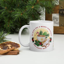 Load image into Gallery viewer, Left side view of white glossy mug with the phrase &quot;We Wish You A Merry Christmas and a Happy New Year,&quot; featuring a festive mug surrounded by gingerbread cookies, holly, pine tree clippings, and a candy cane, with golden sparkles and a yellow circle background.
