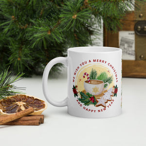 Left side view of white glossy mug with the phrase "We Wish You A Merry Christmas and a Happy New Year," featuring a festive mug surrounded by gingerbread cookies, holly, pine tree clippings, and a candy cane, with golden sparkles and a yellow circle background.