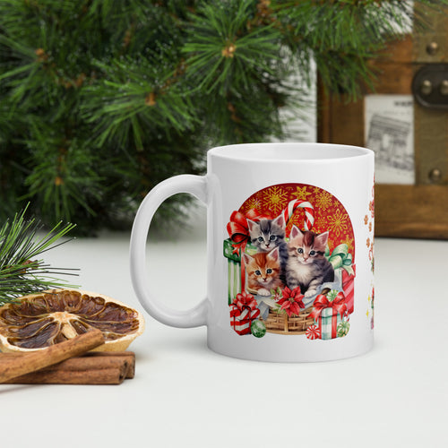 Left side view of a white glossy mug with an image design of adorable kittens nestled among Christmas presents, with a festive holiday background.