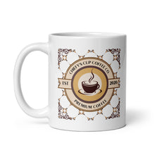 Load image into Gallery viewer, A white ceramic coffee mug featuring a circular coffee-themed graphic with the text 'Chiefy's Cup Coffee Co' and 'Premium Coffee' in brown and gold tones.

