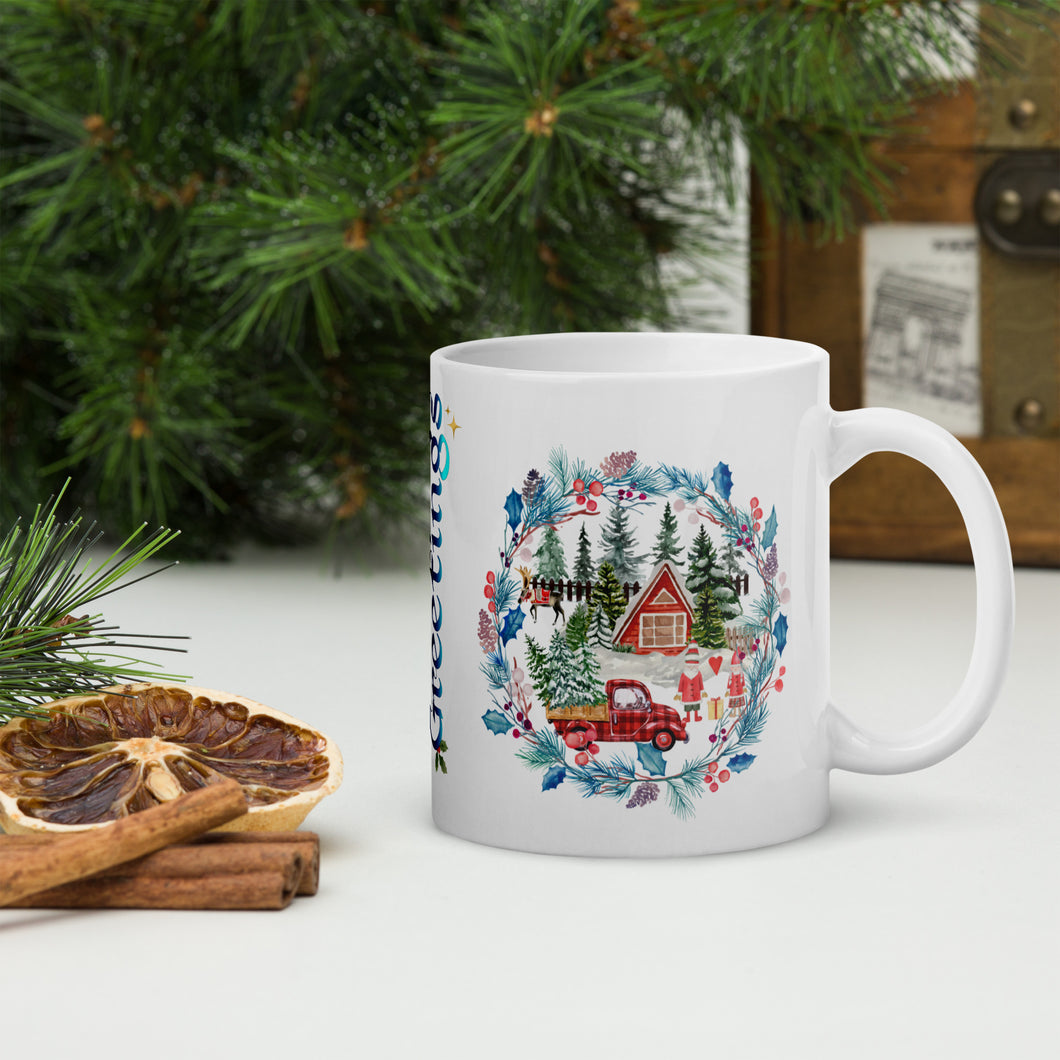 Right side view of a white glossy mug with an image design featuring a red farmhouse, a red plaid truck carrying a Christmas tree, a man and woman holding presents in the front yard, reindeer in the background, and a forest encased in a blue and red-hued wreath.