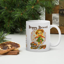 Load image into Gallery viewer, Left side view white ceramic mug with image phrase happy harvest, with image design cute scarecrow behind barrel of hay and barrel of small pumpkins, with small falling leaves, with small sunflowers, with small pumpkins in front, with round yellow purplish circle background
