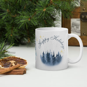 Right side view of a white glossy mug with the image phrase "Happy Holidays" in festive font, featuring vintage-looking pine trees on a wintery day, with golden sparkles.