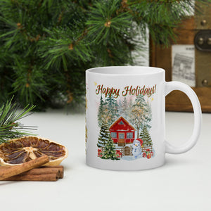 Right side view of white glossy mug with the phrase "Happy Holidays" in festive font, showcasing a wintery scene with a red house, snow-covered trees, a dancing snowman, and a decorated Christmas tree surrounded by gifts and golden sparkles.