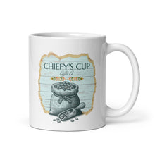 Load image into Gallery viewer, A white ceramic coffee mug featuring a rustic graphic design with the text 'CHIEFY'S CUP Coffee Co.' and an illustration of a sack of coffee beans on a light blue wood-textured background.
