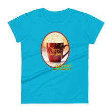 Load image into Gallery viewer, Womens fitted Caribbean blue t-shirt with image phrase happy new year 2025, with image design of a bright red coffee cup surrounded with golden sparkles, with smoky bright reddish yellow hues in the background.
