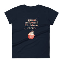 Load image into Gallery viewer, Womens fitted navy colored t-shirt with image phrase in festive font I run on coffee and Christmas cheer, with image design of festive font words, with a Christmas mug topped with whipped cream and a heart shaped topping
